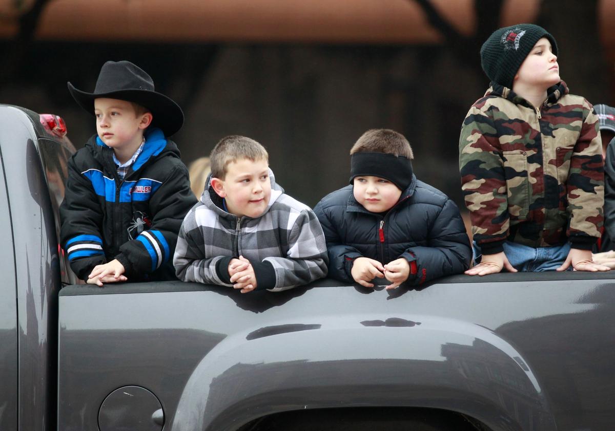 Jan. 15, 2011: Saginaw cowboys K.J. Beavers, 5; and 6-year-olds Levi Johnson, Cade DeSantos and Hayden Norwich  wait for the Stock Show Parade to begin in downtown Fort Worth. 