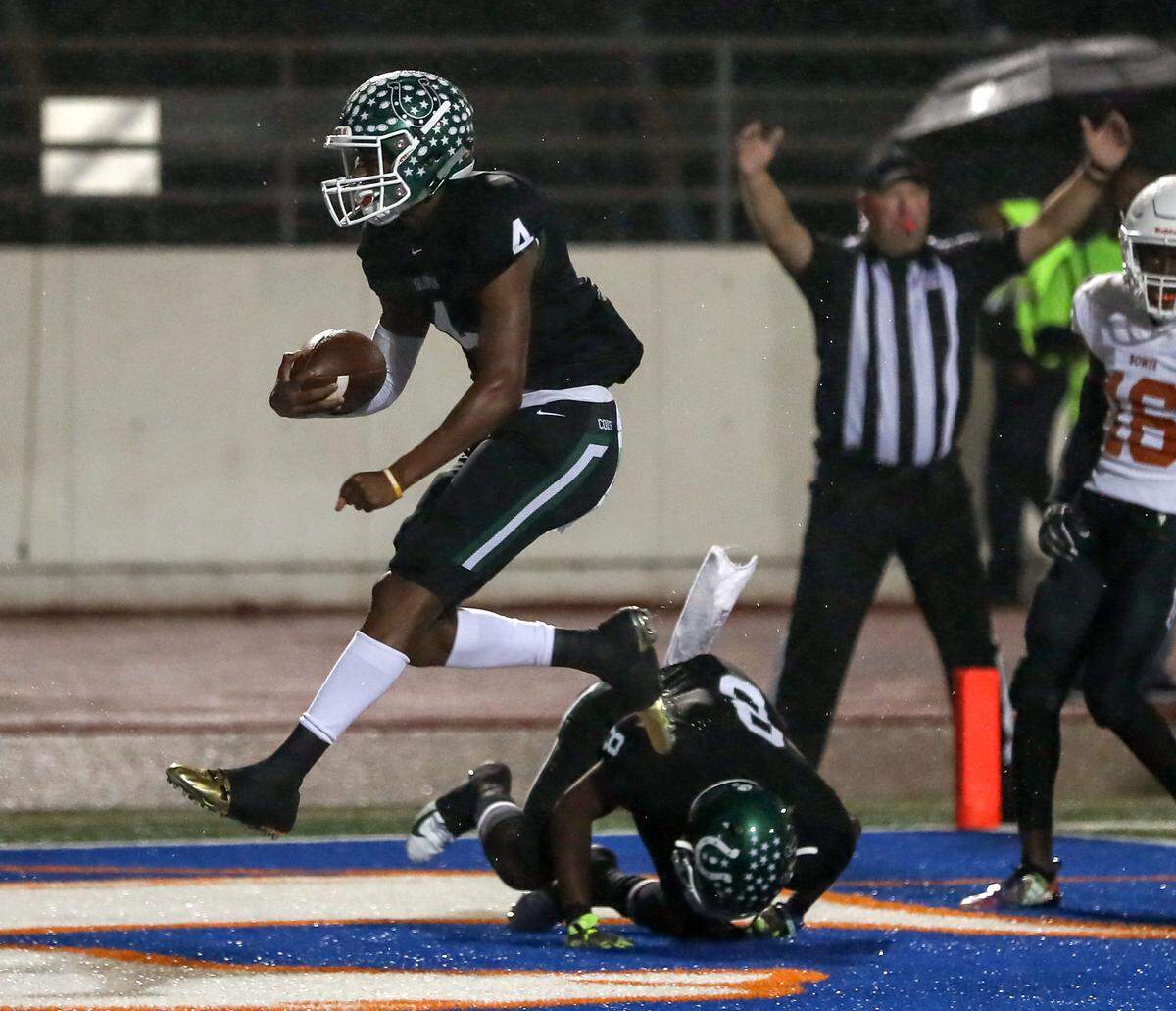 Arlington quarterback Jahari Rogers (4) gets into the endzone for a touchdown against Arlington Bowie during the first half, Friday night, October 12, 2018 played at Maverick Stadium in Arlington, TX.