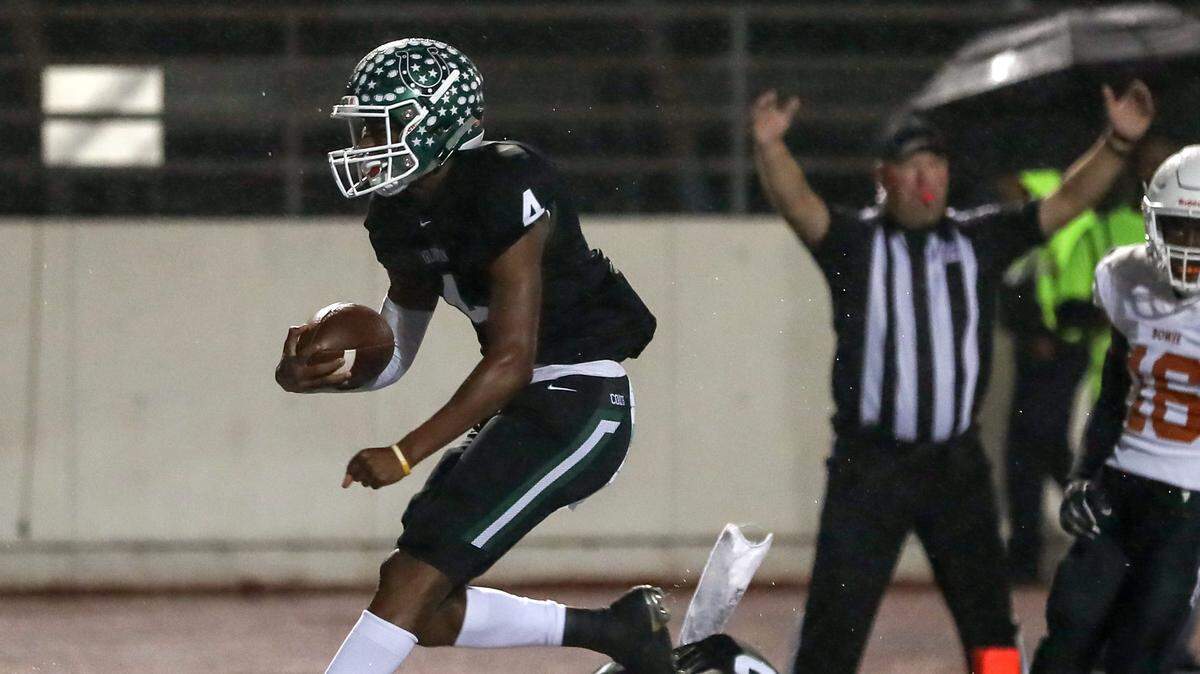 Arlington quarterback Jahari Rogers (4) gets into the endzone for a touchdown against Arlington Bowie during the first half, Friday night, October 12, 2018 played at Maverick Stadium in Arlington, TX.