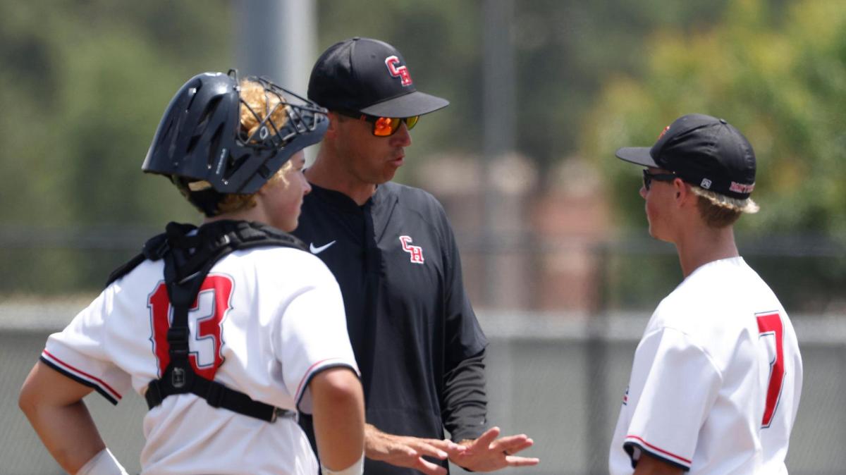 Colleyville Heritage head coach Chris McMullen goes to the mound to calm pitcher Blake Sibley (7) during the UIL baseball regional final 5A D1 playoff game at Hawk Baseball Field in North Richland Hills, Texas, Thursday, May 22, 2025.