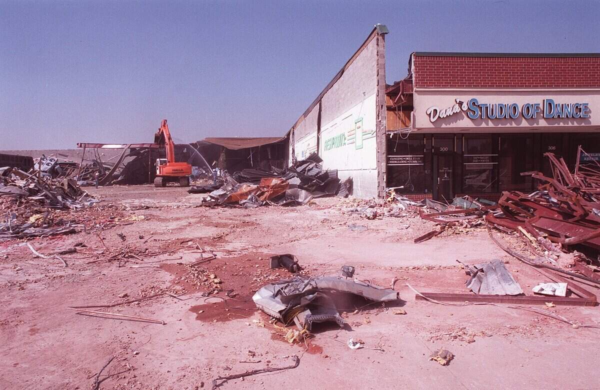 Oct. 12, 1999: Workers demolish a portion of a shopping center on the corner of Southlake Boulevard (FM 1709) and North White Chapel in Southlake.