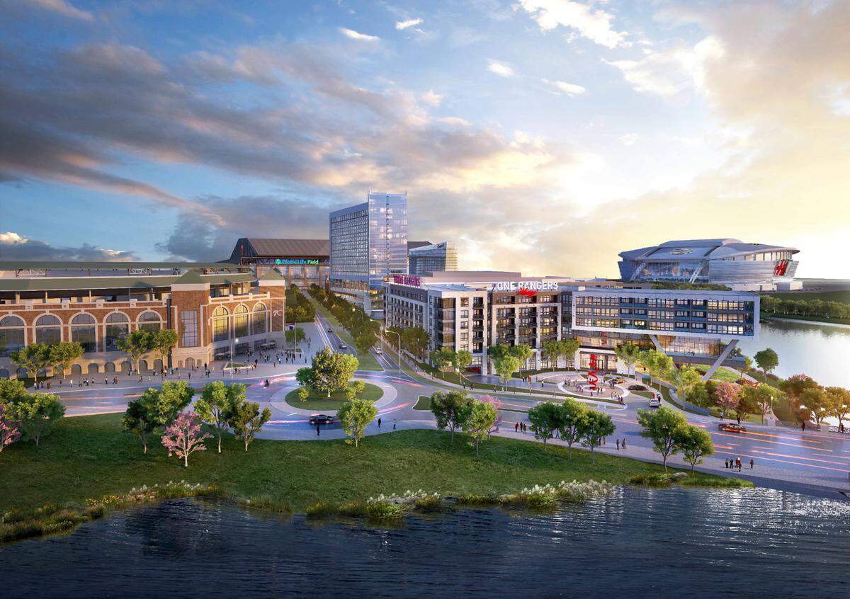 An aerial view of One Ranger Way apartments across the road from Choctaw Stadium and next to the Loews Arlington Hotel and Convention Center that is under construction. Globe Life Field is next to the hotel and convention center and AT&T Stadium can be seen behind the apartments.