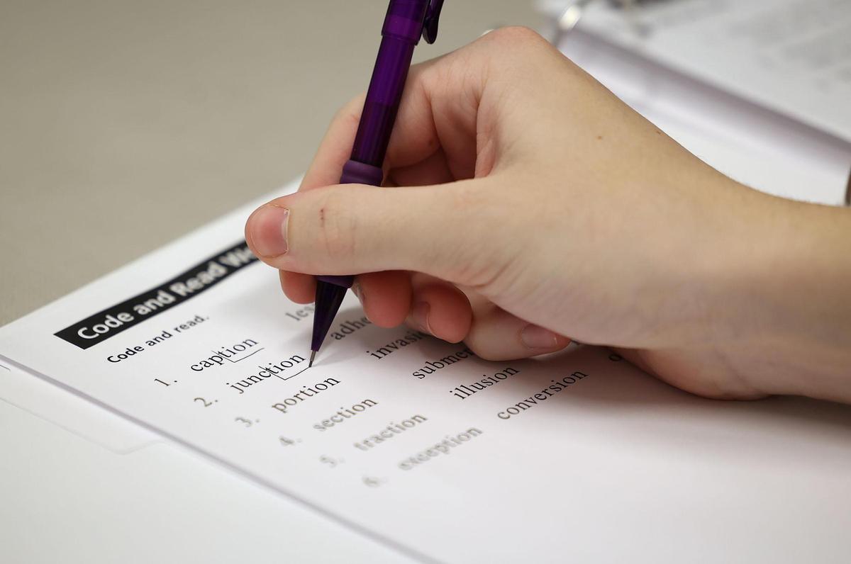 Andrew James, 16, breaks down words while working with a certified academic language therapist at Key School and Training Center on Dec. 5, 2024, in Fort Worth. Key School is a private school that specializes in working with students with dyslexia and other disabilities like ADHD and autism.