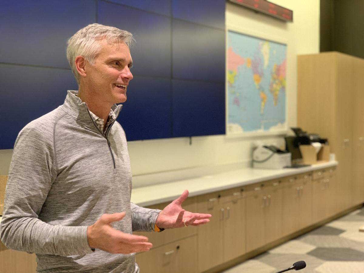 Robert Isom, American Airlines Group president, greets overnight visitors at the company’s Integrated Operations Center in Fort Worth.