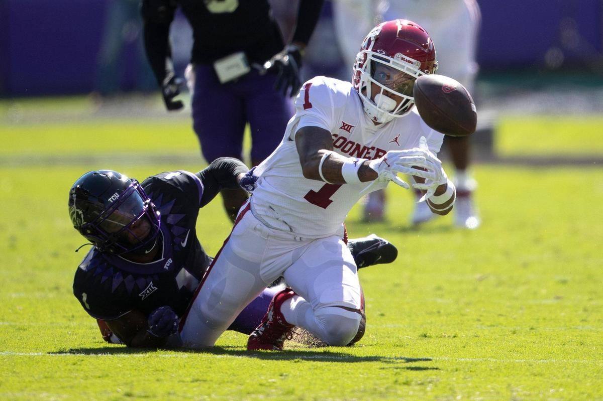 OU wide receiver Jayden Gibson is downed by TCU TCU cornerback Tre’Vius Hodges-Tomlinson at the Amon G. Carter Stadium in Fort Worth, Texas, on Saturday, Oct. 1, 2022.