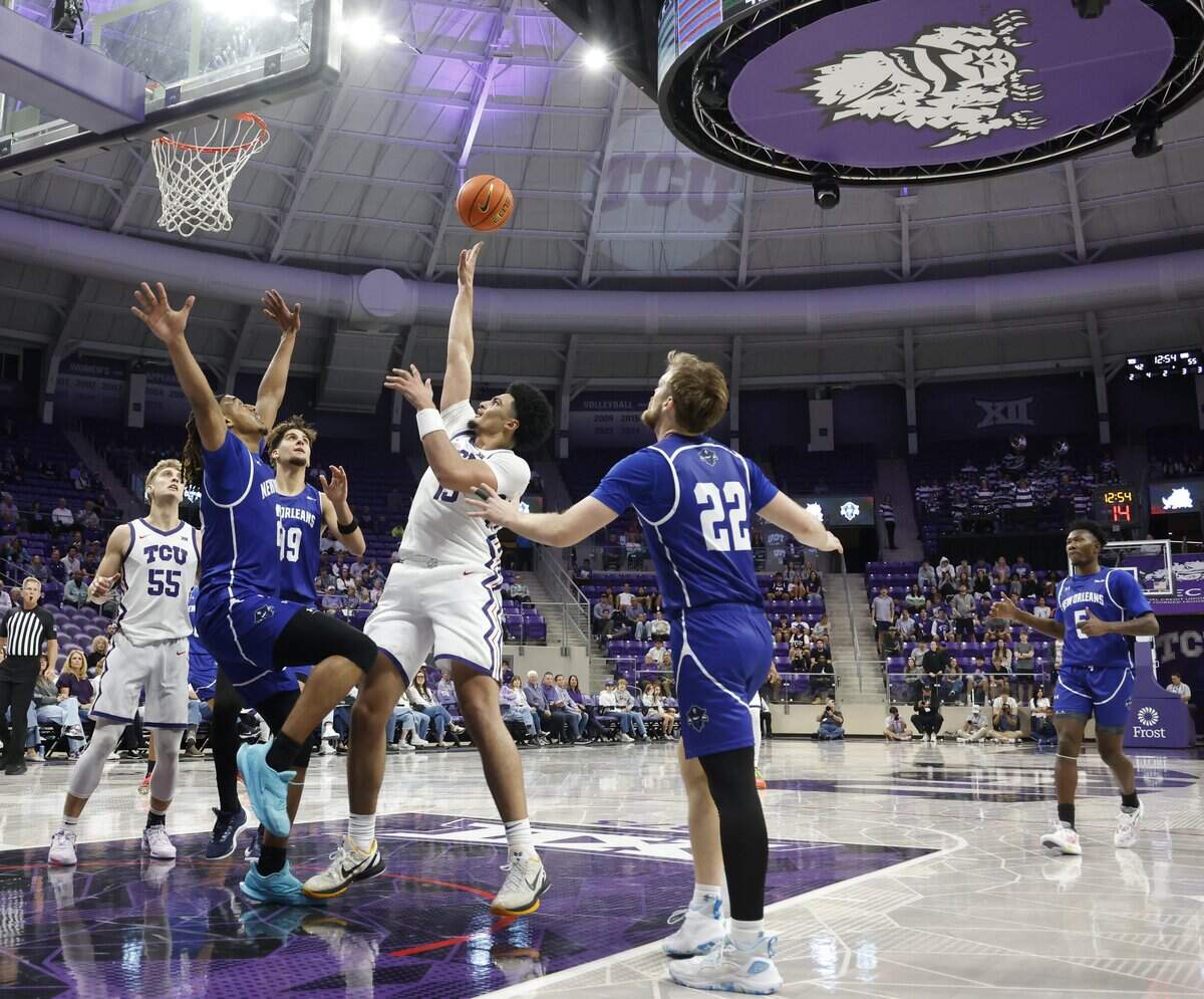TCU forward David Punch (15) puts the light touch on two during the second half of a NCAA basketball game between New Orleans University and TCU at Schollmaier Arena in Fort Worth, Texas, Monday Nov. 03, 2025. The Horned Frogs dropped their home opener 78-74 to the Privateers.