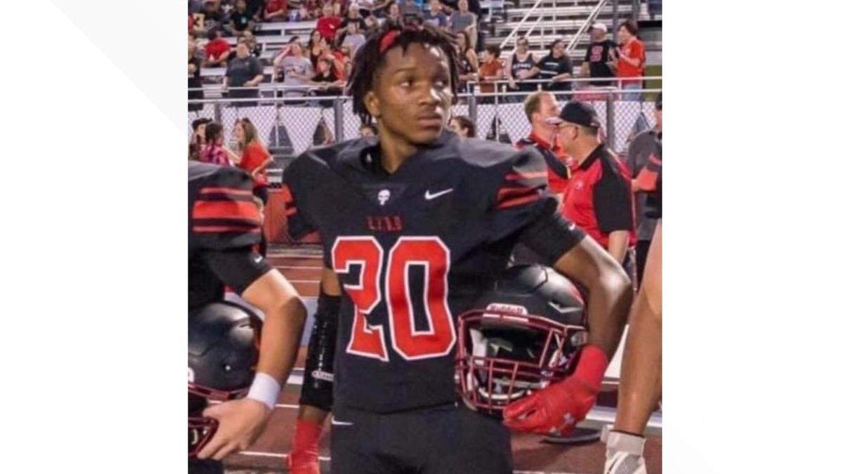 Tre Allison, 16, stands on the sidelines of a Burleson High School football game. He was killed in a hit-and-run crash on Monday night and hundreds of members of the Burleson community gathered at Burleson ISD Stadium Wednesday night to honor him with a candlelight vigil.