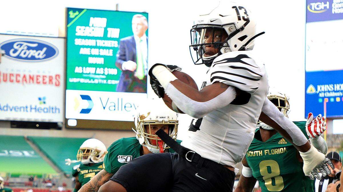 Kedarian Jones of the Memphis Tigers is forced out of bounds against South Florida at Raymond James Stadium in Tampa, Fla., on Saturday, Nov. 23, 2019. Memphis won 49-10. Jones, a former Dallas Kimball standout who is playing in Saturday’s Cotton Bowl in Arlington against Penn State, says he prefers Texas barbecue over Memphis-style.
