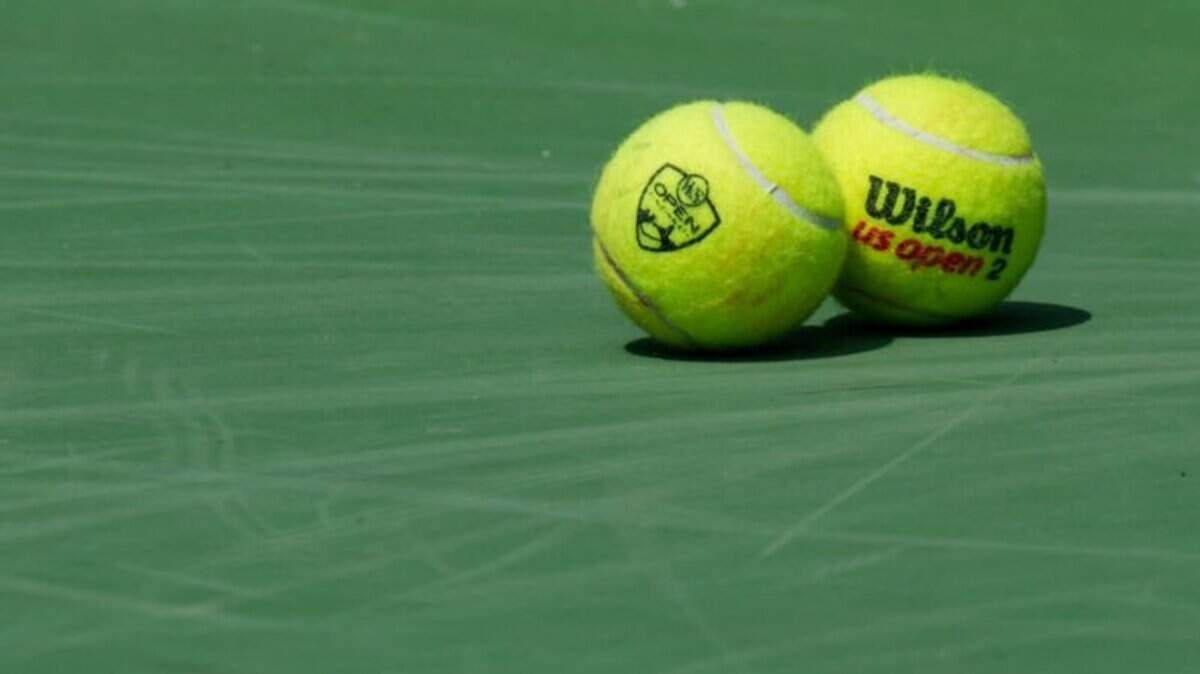 Tennis balls lie on the court at the Western & Southern Open.