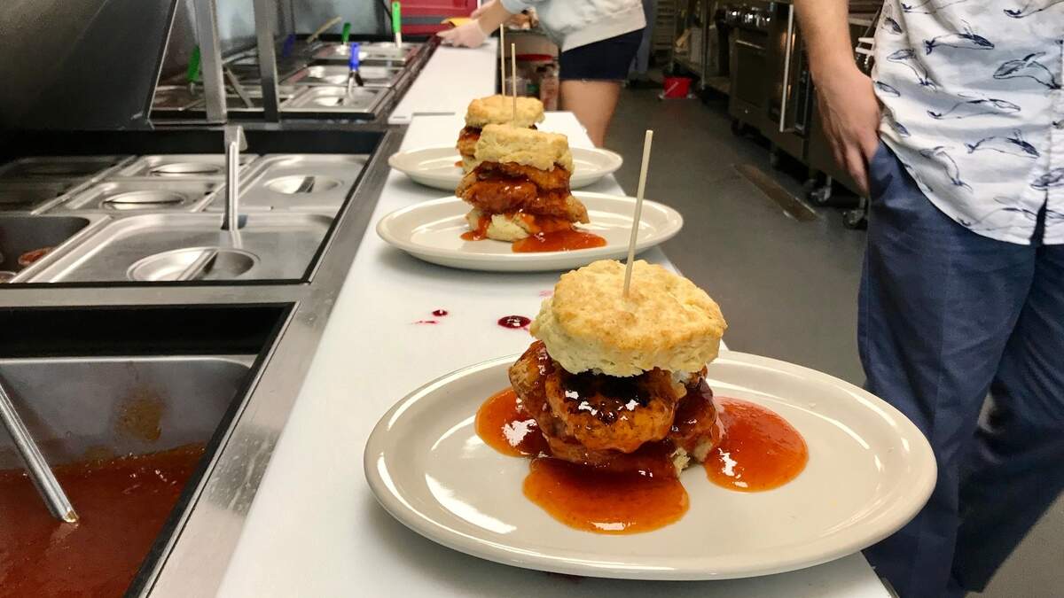 “Squawking Goat” is one of the popular offerings at Maple Street Biscuit Company. Ingredients include a fried chicken breast, a fried goat cheese medallion and house-made pepper jelly on a biscuit.