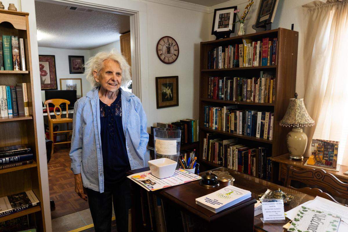 Cathie Jackson stands in her shop, Catherine Anne’s Books, on Bates Street where the city has started to reconstruct the road in Old Town Wednesday, April 13, 2022, in Keller.