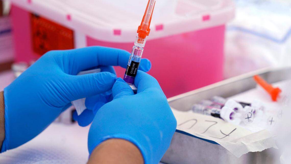 It’s not too late to get your annual flu shot or the latest COVID-19 vaccine. Here’s what to know about cases in Sedgwick County and across Kansas. (AP Photo/Mark J. Terrill)