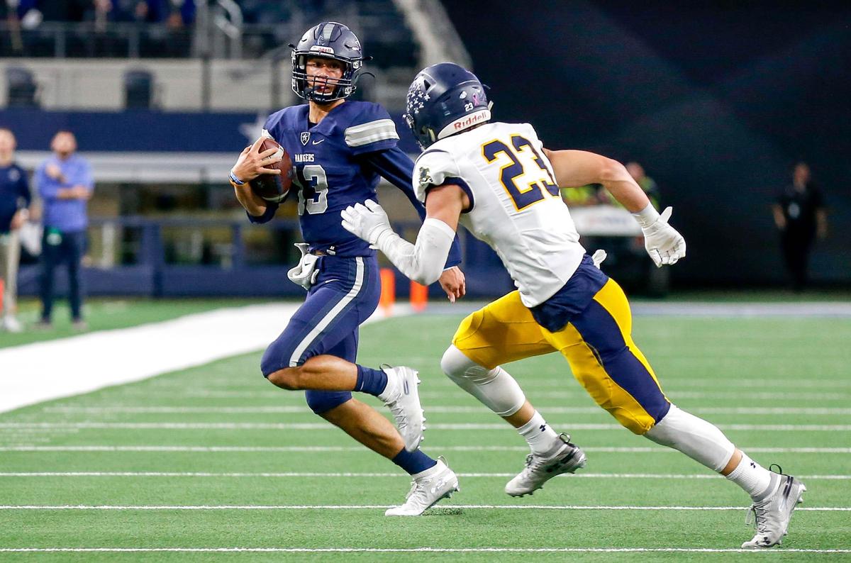 Frisco Lone Star quarterback Garret Rangel (13) tries to get past Highland Park defensive back Andrew Bonnet (23) during the first half of their 5A Division I Regional Round High School Football playoff game at AT&T Stadium in Arlington, Tx Friday November 29, 2019.