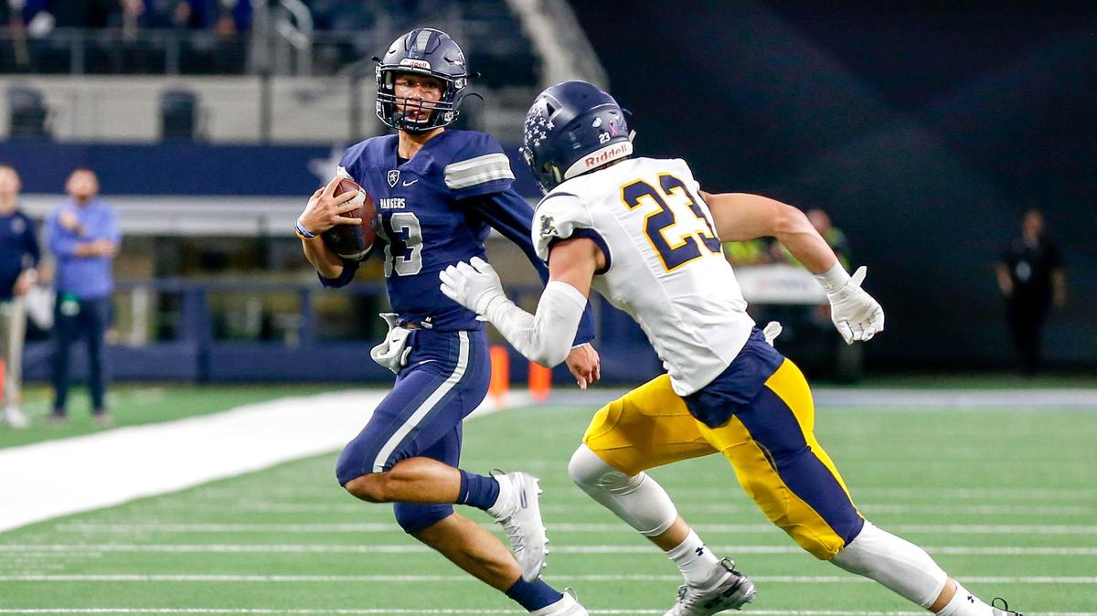 Frisco Lone Star quarterback Garret Rangel (13) tries to get past Highland Park defensive back Andrew Bonnet (23) during the first half of their 5A Division I Regional Round High School Football playoff game at AT&T Stadium in Arlington, Tx Friday November 29, 2019.