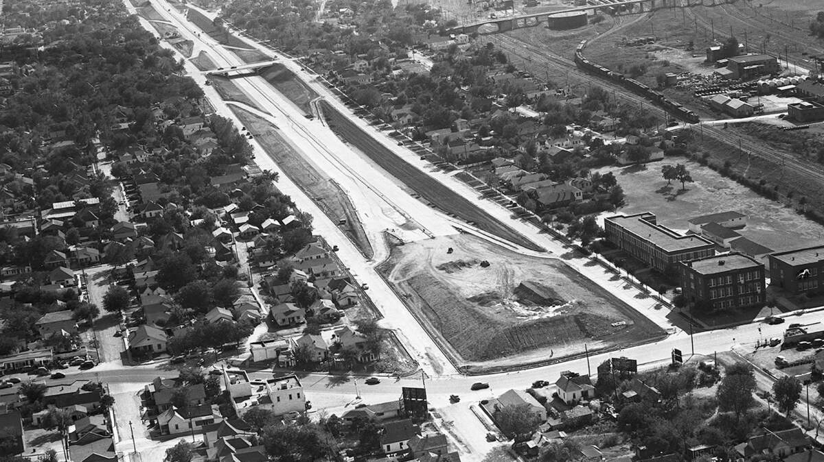 A 1951 aerial view of the North-South Expressway (now I-35W) from Morningside Drive (upper left) to East Rosedale and the James E. Guinn school complex (right center). The highway divided the Morningside neighborhood.