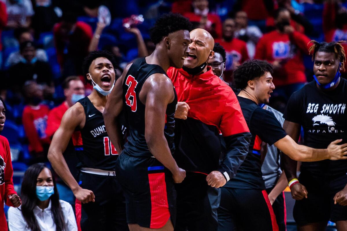 Damon Nicholas (25) celebrates with his coach Davis Peavy after drawing s shooting foul in the 2nd half of the 6A state final between Duncanville and Austin Westlake at the Alamodome in San Antonio Texas, on March 13, 2021. Duncanville went on to win 66-53. (Photo by Matt Smith. Special to the Star-Telegram).