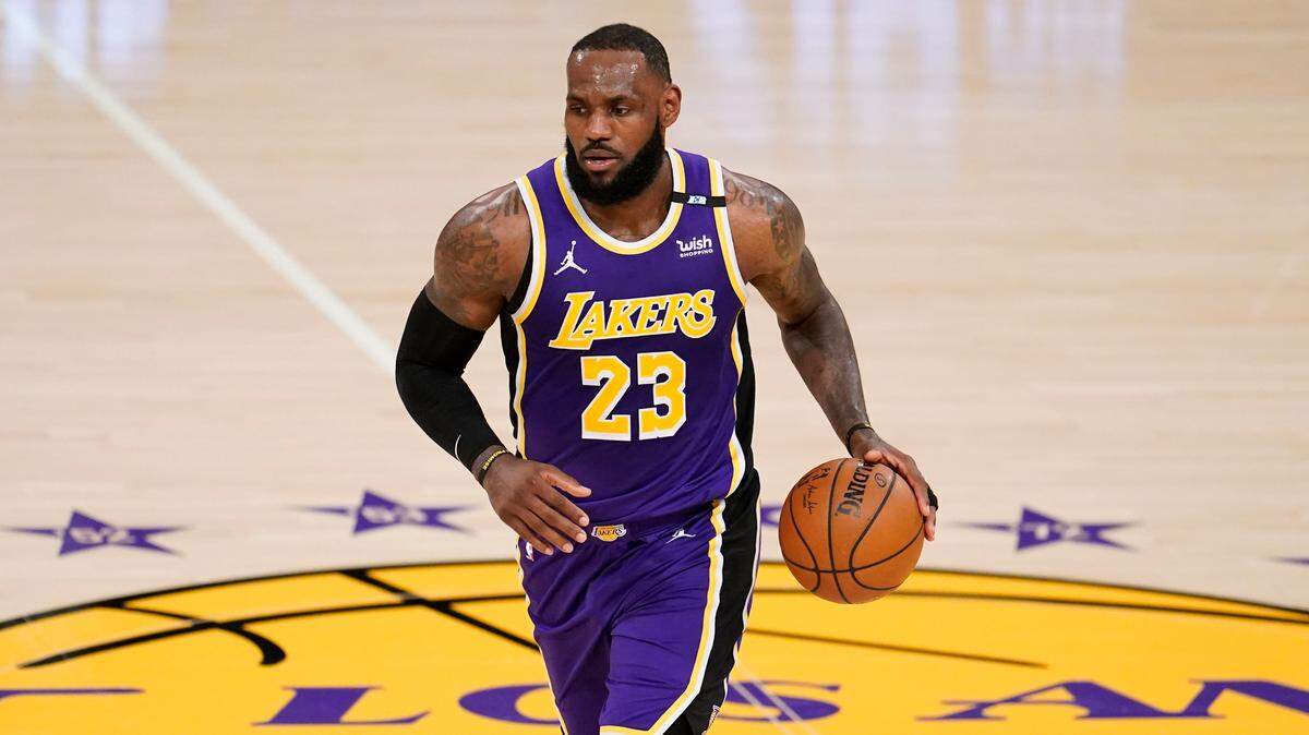 Los Angeles Lakers forward LeBron James dribbles during the first half of an NBA basketball game against the Sacramento Kings Friday, April 30, 2021, in Los Angeles. (AP Photo/Marcio Jose Sanchez)