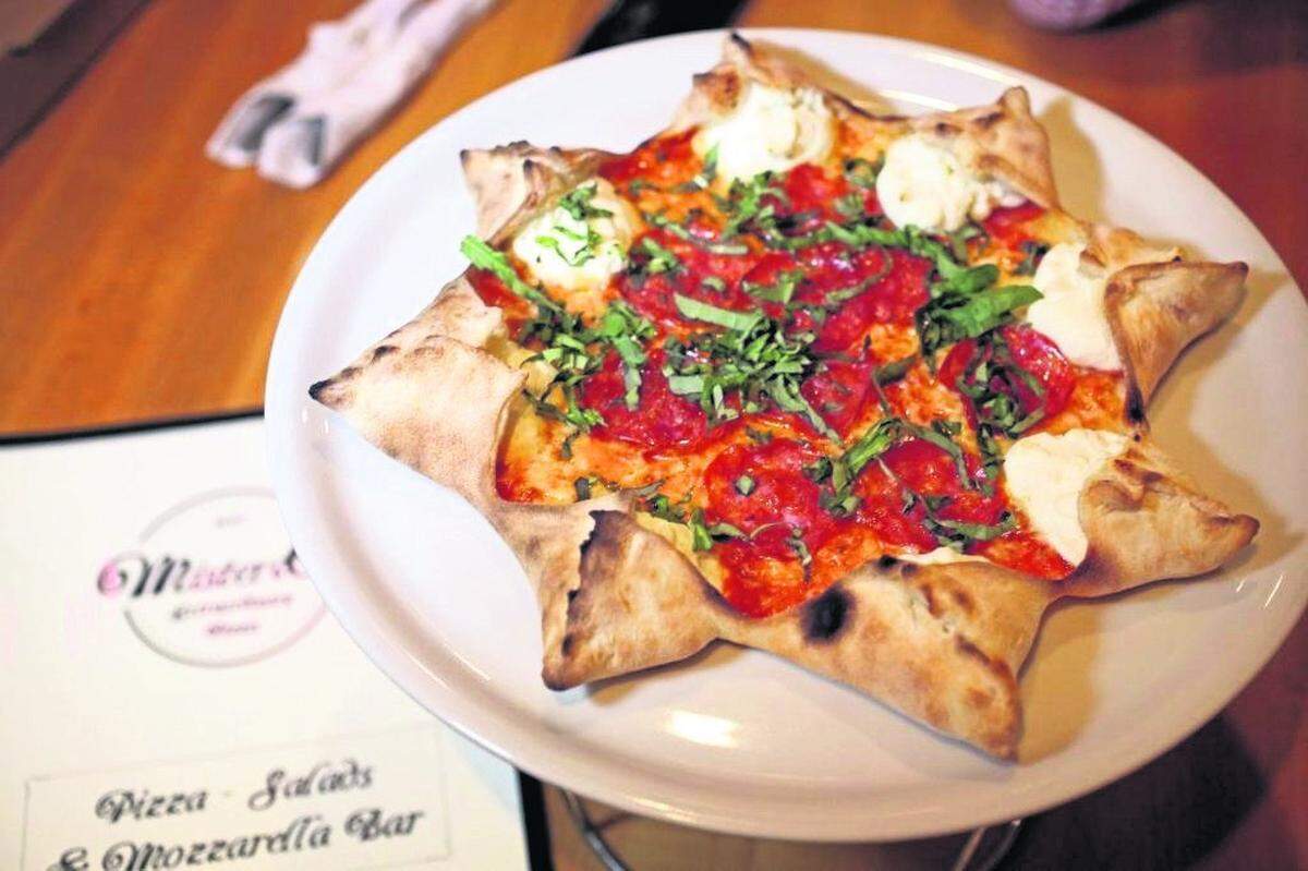The famous Star Luca pizza at Mister O1 Extraordinary Pizza in Miami Beach. The small pizzeria became a huge hit despite being buried inside an office building with no sign out front.
