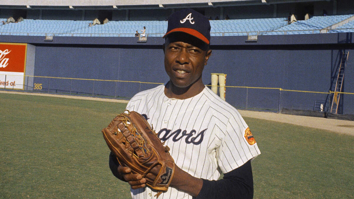 Hank Aaron, seen here in 1967 with the Atlanta Braves, played in the majors from 1954 to 1976. He’s the all-time leader in RBIs and total bases and is second all-time with 755 home runs. Aaron died on Friday at age of 86.