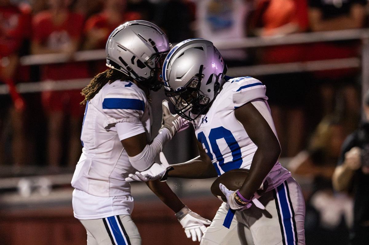 Burleson Centennial wide receiver Simeon Bennett (7) celebrates with running back Jaylon Walker (20) after Walker scored a touchdown in the second quarter of the 2024 Boot Bowl game against Burleson High School at BISD Stadium in Burleson on Friday, Aug. 30, 2024.