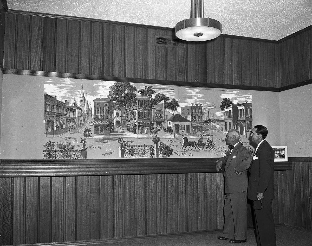 Aug. 2, 1950: Inside the newly completed office building for McKeever & Company, located at 2509 W. Berry St. Fred Hammond, left, and salesman Charles M. Kyser are looking at a mural depicting a street in New Orleans, that hangs inside the office of Warren W. McKeever.