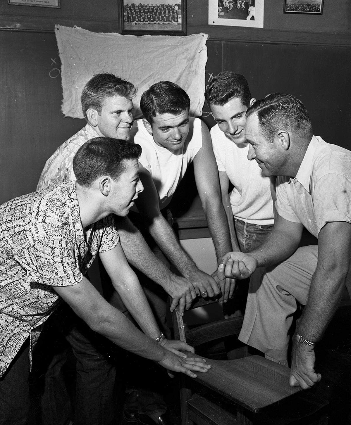 Aug. 22, 1951: Coach Bill Allen greets four returning Paschal High School letterman: Johny Cozart, left, Don Driggin, Bobby Hughes and Jerry Bowen.
