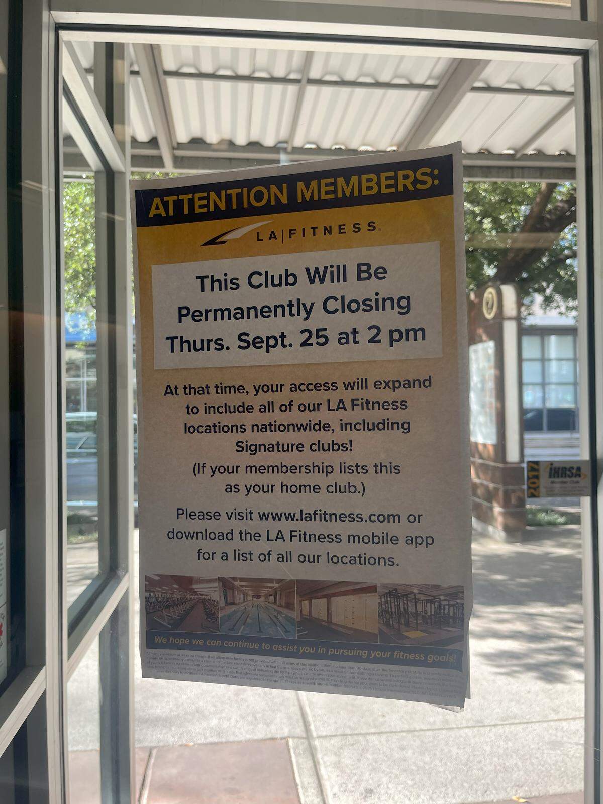 A sign posted on the doors of LA Fitness at 2860 Crockett Street, Fort Worth.