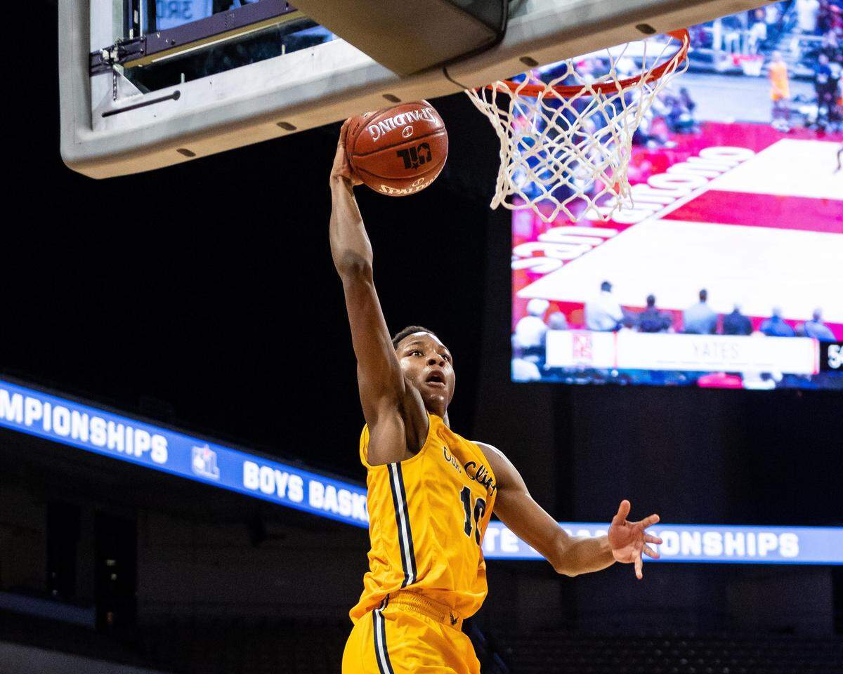 Faith Family’s Trae Clayton goes in for a dunk for 2 of his game-high 35 points vs. Houston Yates in the 4A state semifinals at the Alamodome, Friday March 8, 2019.