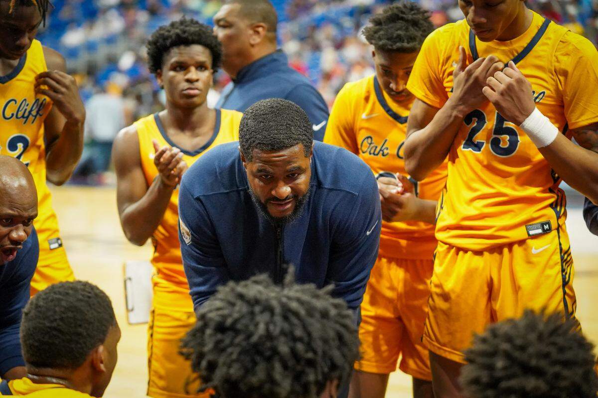 Dallas Oak Cliff Faith Family head coach Brandon Thomas talks to his team during a time out against Stafford in a Class 4A state semifinal on Friday, March 8, 2024 at the Alamodome in San Antonio, Texas. Faith Family defeated Stafford 59-40.