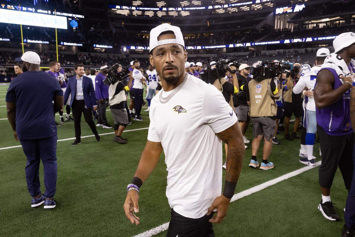Ravens wide receiver Tylan Wallace walks on the field to greet players after an NFL preseason game between the Dallas Cowboys and the Baltimore Ravens at AT&T Stadium in Arlington on Saturday, Aug. 16, 2025,