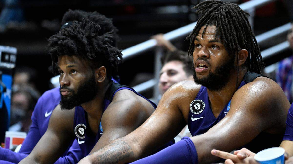 TCU’s Mike Miles, left, and Eddie Lampkin, right, sit on the bench during the second half of a second-round NCAA college basketball tournament game against Arizona, Sunday, March 20, 2022, in San Diego. Arizona won 85-80 in overtime. (AP Photo/Denis Poroy)