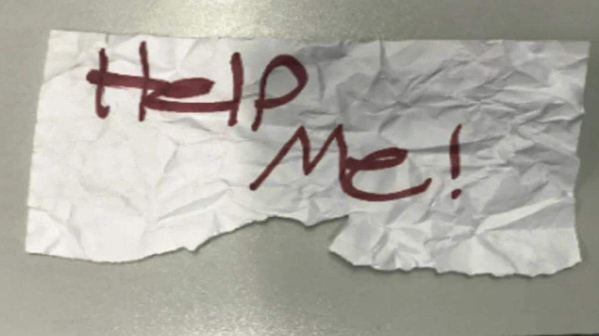 A 13-year-old kidnapping victim wrote this sign reading, “Help me!” to get the attention of a passerby after a Texas man abducted the girl and sexually assaulted her on a road trip that ended in California, federal authorities say.