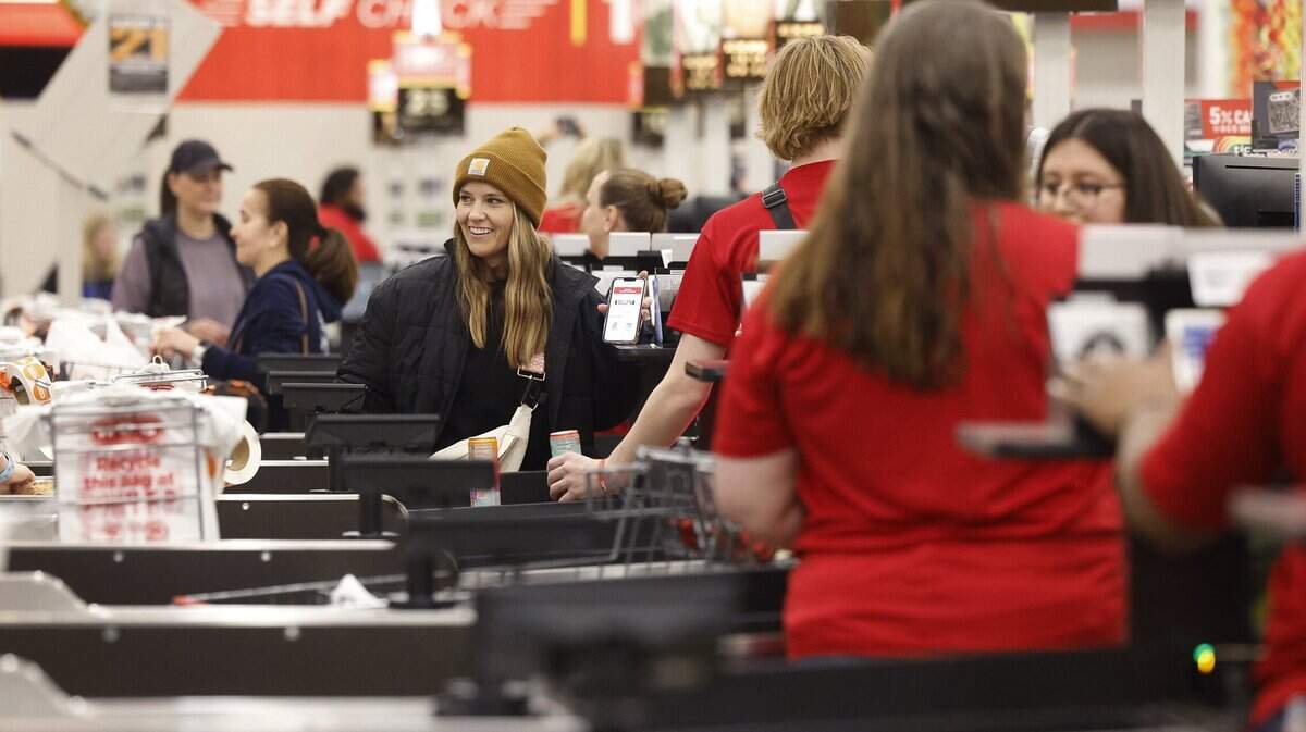 Customers check out at the registers of the Fort Worth Alliance H-E-B on Wednesday, April 10, 2024. Hundreds lined up for the opening of the store.