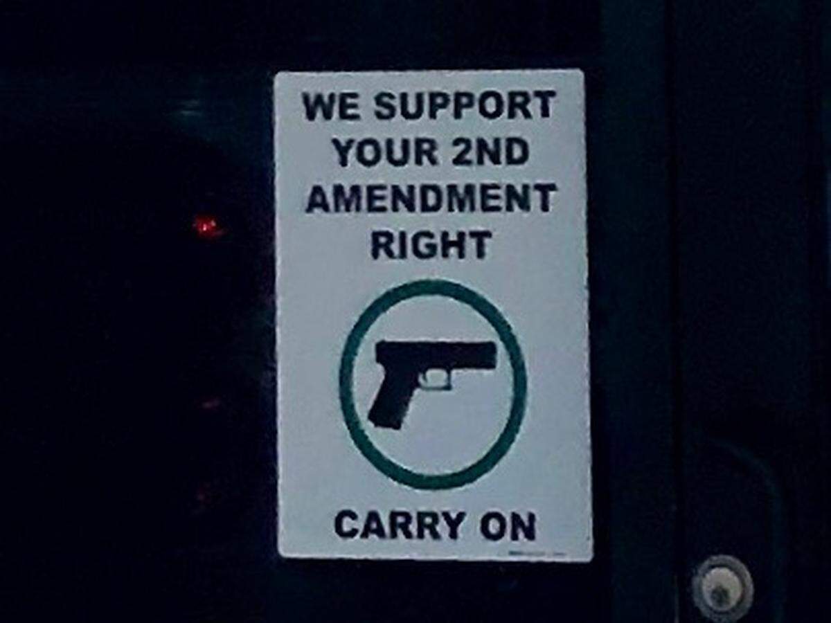 A sign at the door welcomes gun licensees.