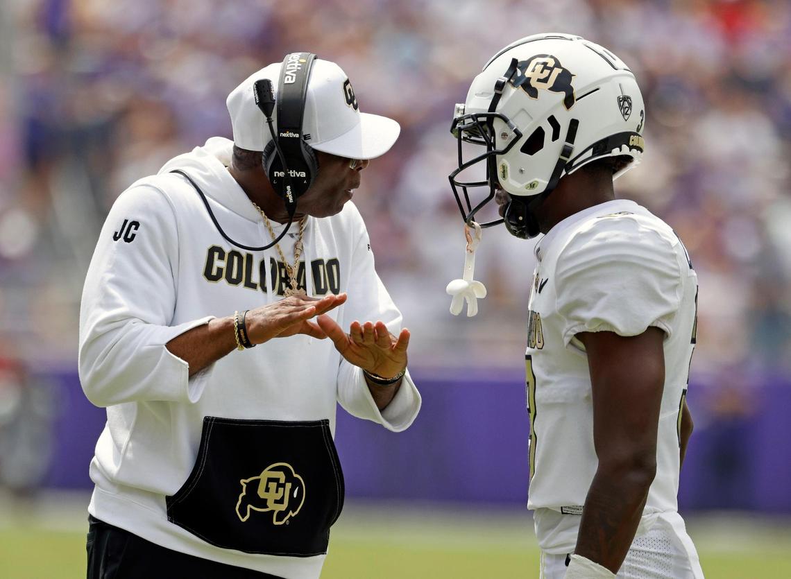 Colorado head coach Deion Sanders talks to Colorado corner back Omarion Cooper (3 in the first half of a NCAA football game at Amon G. Carter Stadium in Fort Worth,Texas, Saturday Sept. 02, 2023. Colorado led 17-14 at the half. (Special to the Star-Telegram Bob Booth)