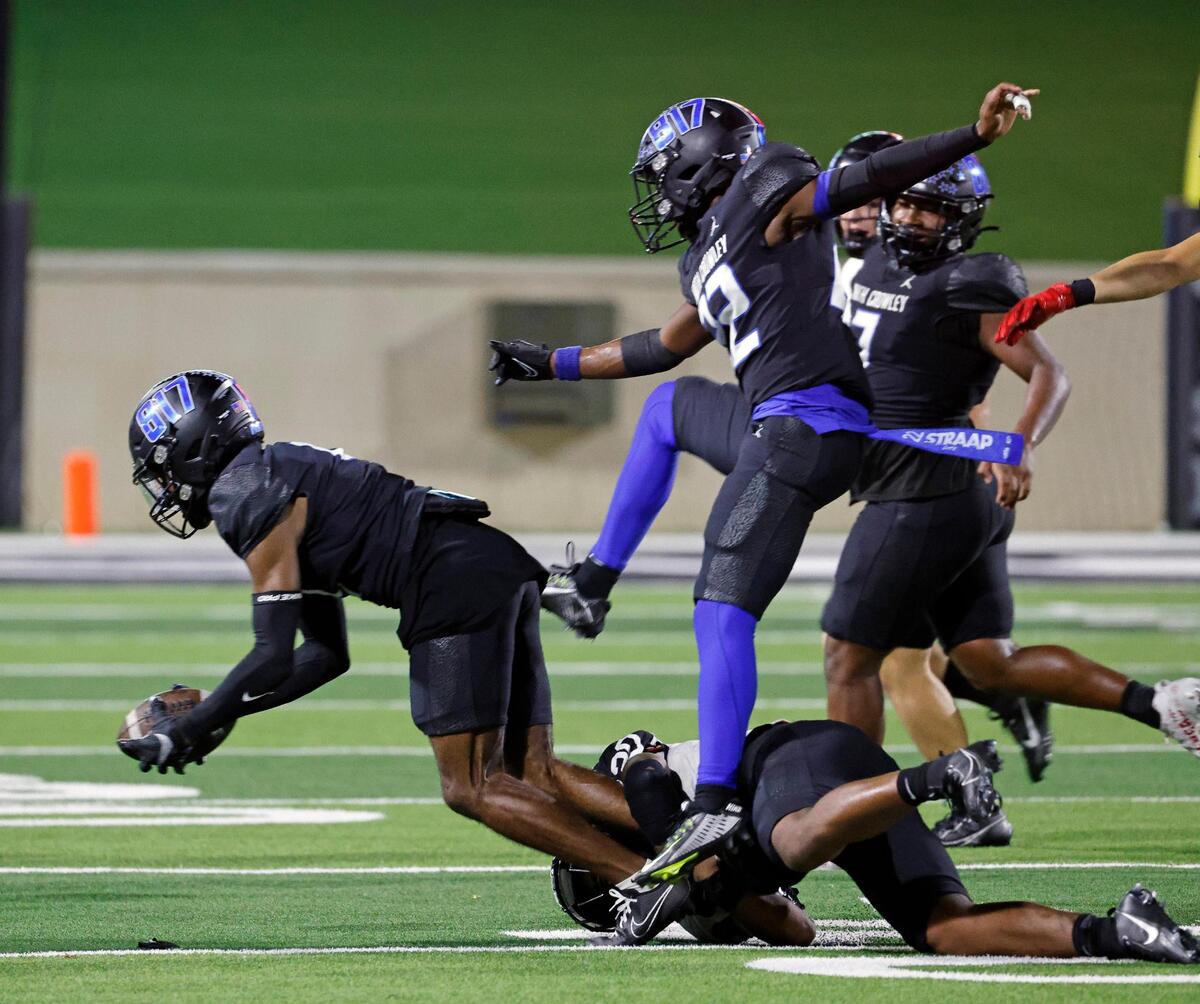 North Crowley cornerback David Moore (4) recovers a Trinity fumble in the first half of a UIL high school football game at Crowley ISD Multi-Purpose Stadium in Crowley, Texas, Friday, Sept. 22, 2023.