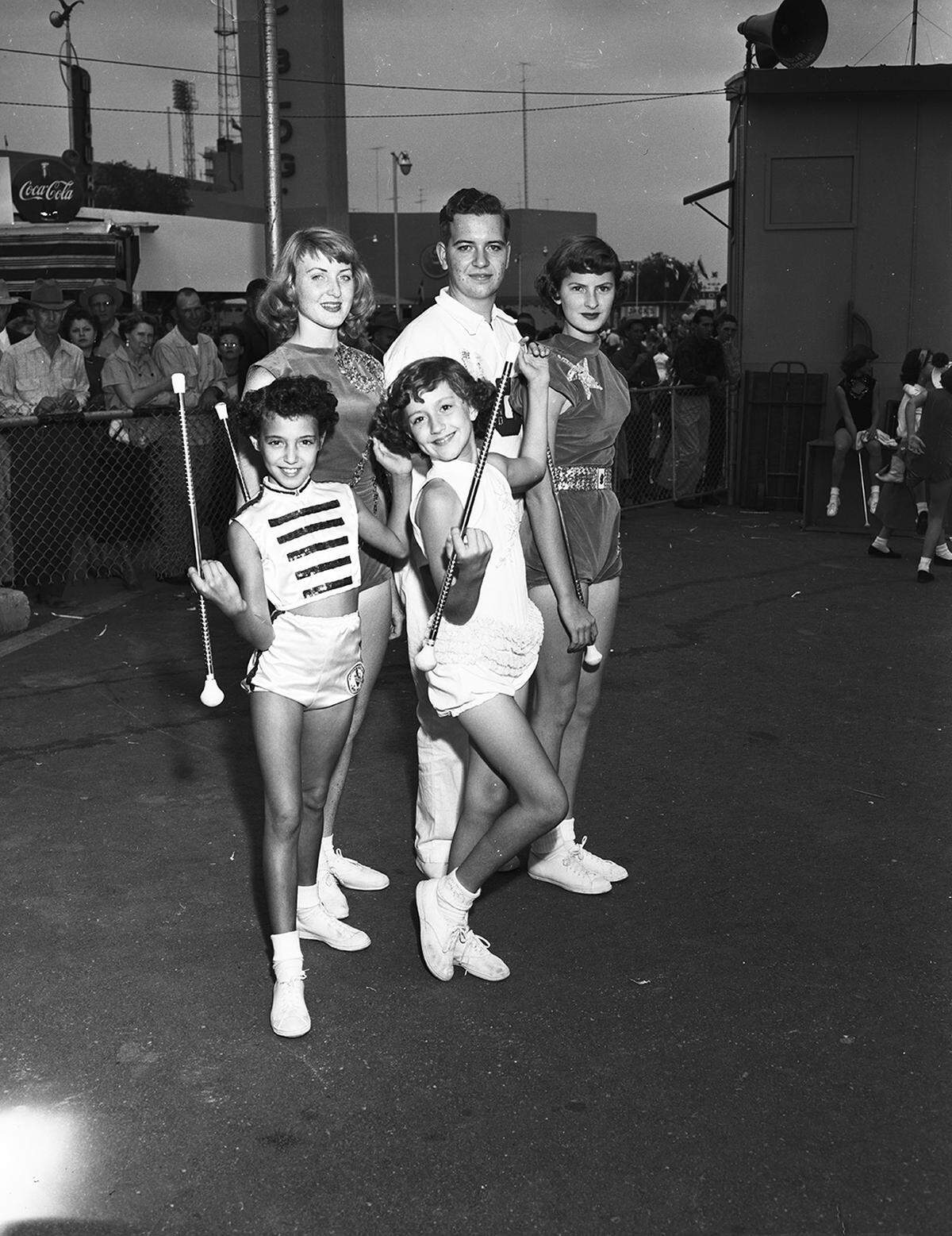 Oct. 24, 1953: Fort Worth visitors performed during Fort Worth Day at the State Fair of Texas in Dallas. Among the 100 school students participating in the state baton twirling contest were four from Tarrant County. Left to right, front row, are Twila McCoy at 2916 Westbrook; Connie Anderson of Arlington, winner of the juvenile division; back row, Patsy Carleton of 1317 Kings Highway; Don Burkhart of 3908 Creech, and Barbara Haddock of 4800 Parrish Rd.