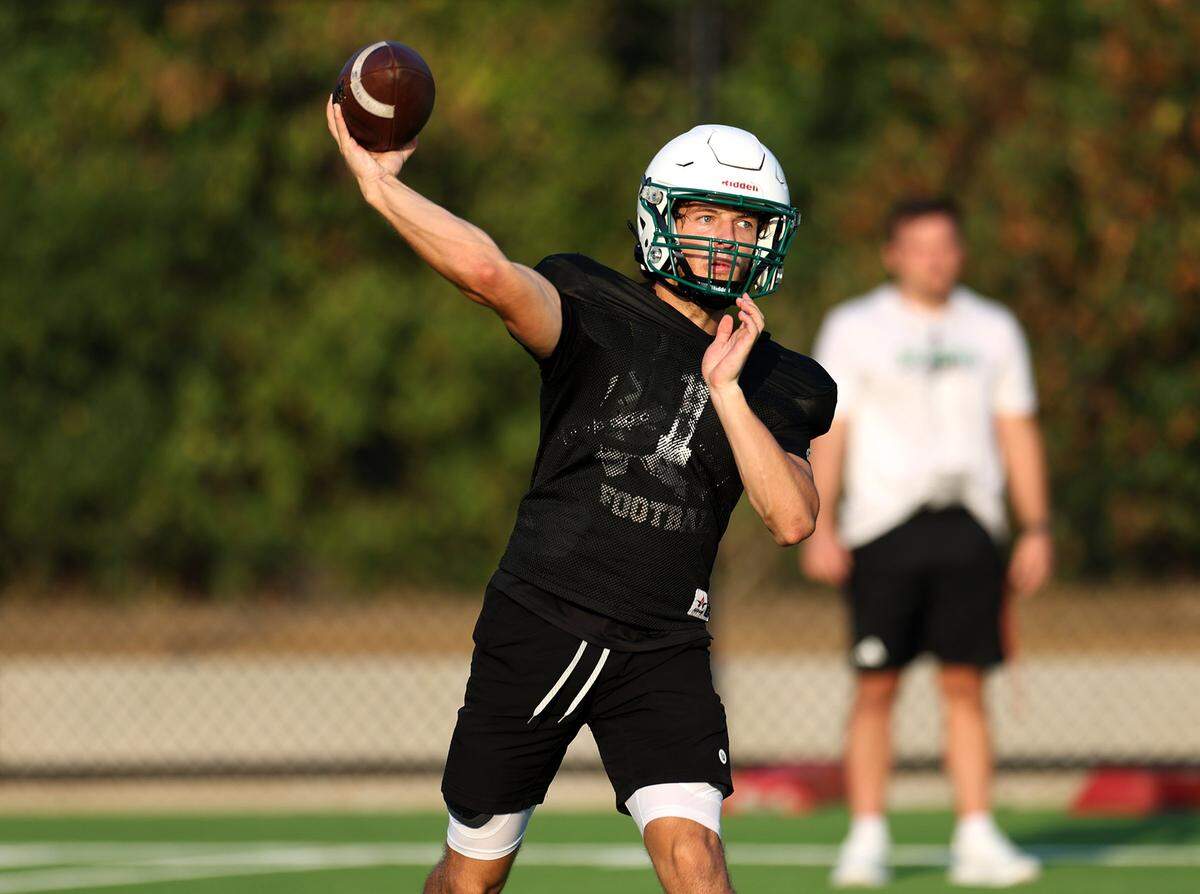 Southlake Carroll football quarterback Angelo Renda throws the ball while running drills during morning practice on Wednesday, Aug. 6, 2025, in Southlake.