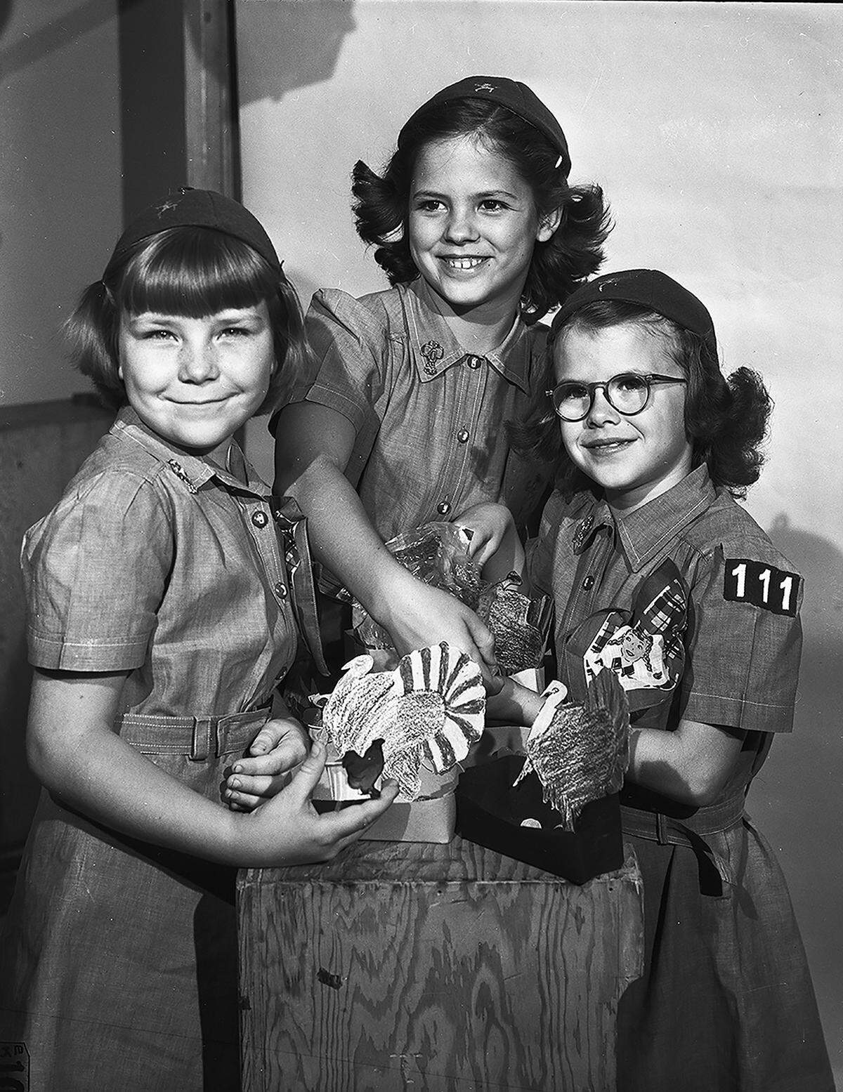 Nov. 15, 1951: Fort Worth Girl Scouts and Brownies are making favors to be placed on hospital patients’ trays on Thanksgiving. Working on the favors are, left to right, Jane Tackett, 8, daughter of Mr. and Mrs. L.E. Tackett; Phylis Osterhout, 9, daughter of Mr. and Mrs. R.V. Osterhout, and Sandra Hamilton, 8, daughter of Mr. and Mrs. Tee Hamilton.