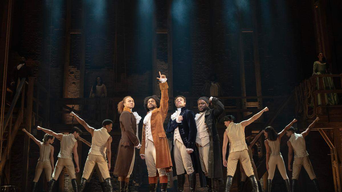 Nathan Haydel, left, Tyler Fauntleroy, Jared Howelton, Elvie Ellis, and company in the “Hamilton” national tour.