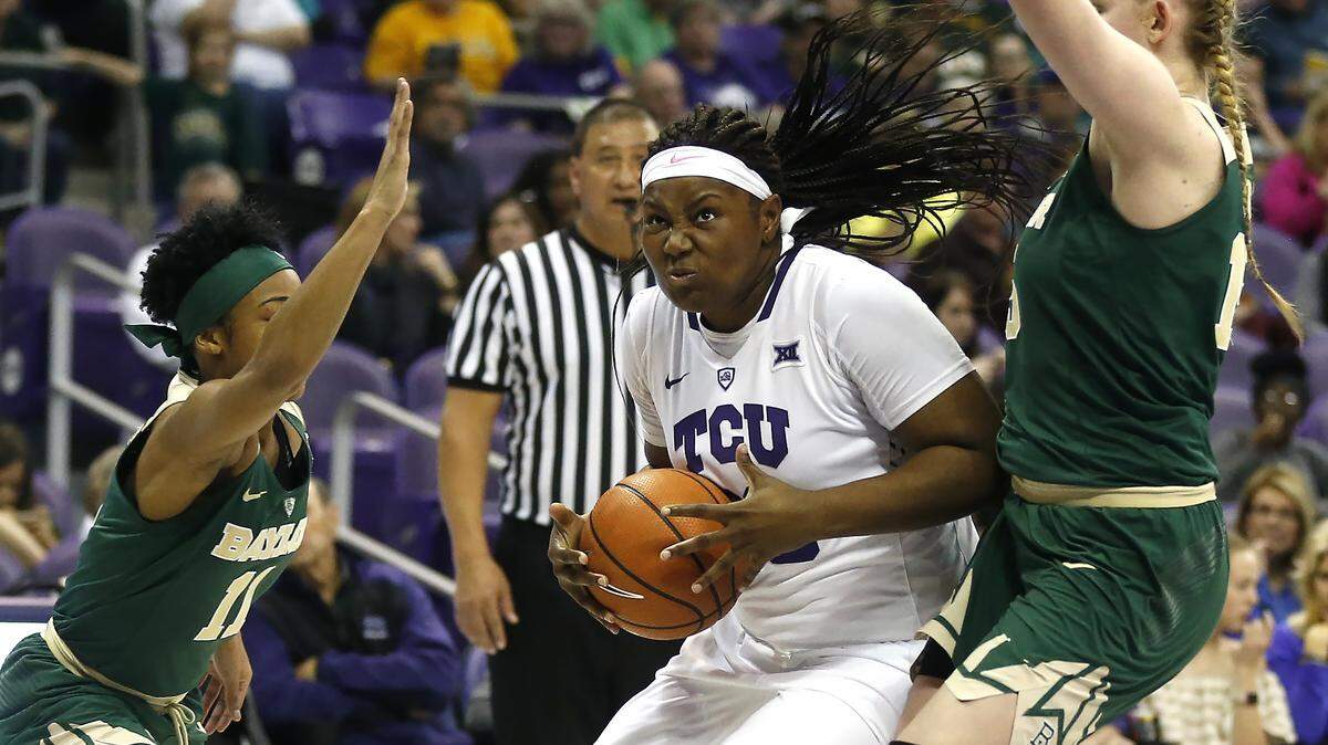 TCU forward Amy Okonkwo (00) tries to get past Baylor guard Alexis Morris (11) and forward Lauren Cox (15) during the second half Saturday.
