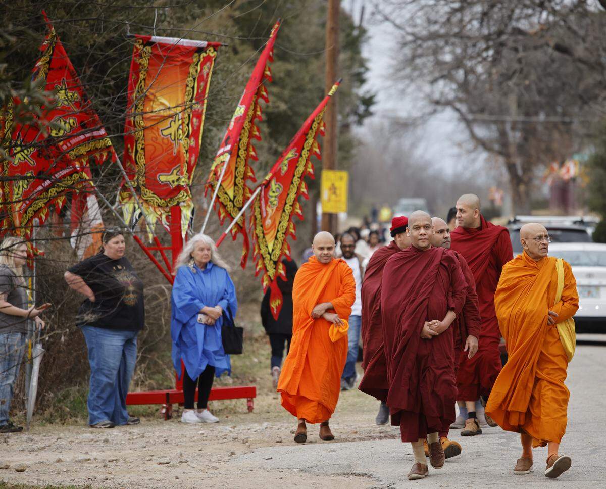 Local Buddhist monks arrive to greet monks who walked nearly 2,300 miles to Washington, D.C., for peace arrive back to the Húóng Do Vipassana Bhavana Center in Fort Worth, Texas, on Saturday, Feb. 14, 2026.