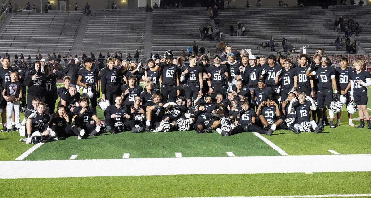 The Grandview football team poses after defeating Whitesboro on Thursday, November 14, 2024 at Mustang-Panther Stadium in Grapevine, Texas.