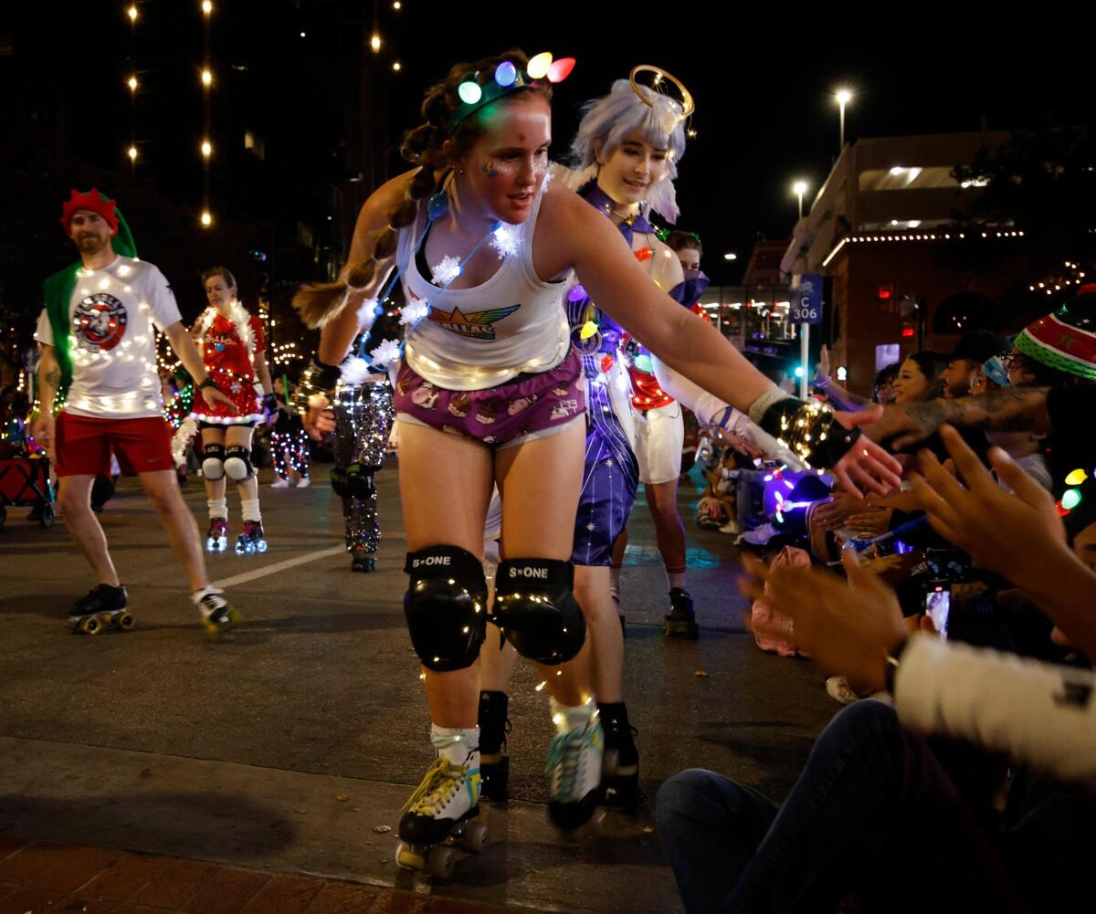 The Dallas Derby Devils greeted fans along the route during the 2024 Parade of Lights.