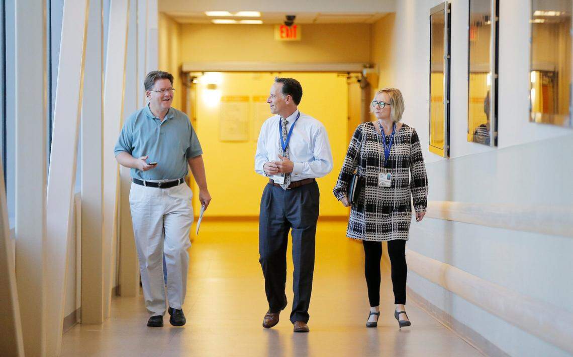 In this 2015 photo, Star-Telegram reporter Bill Hanna, left, gets a tour of JPS Hospital with Robert Earley, president and CEO, and J.R. Labbe, vice president of communications and community affairs.