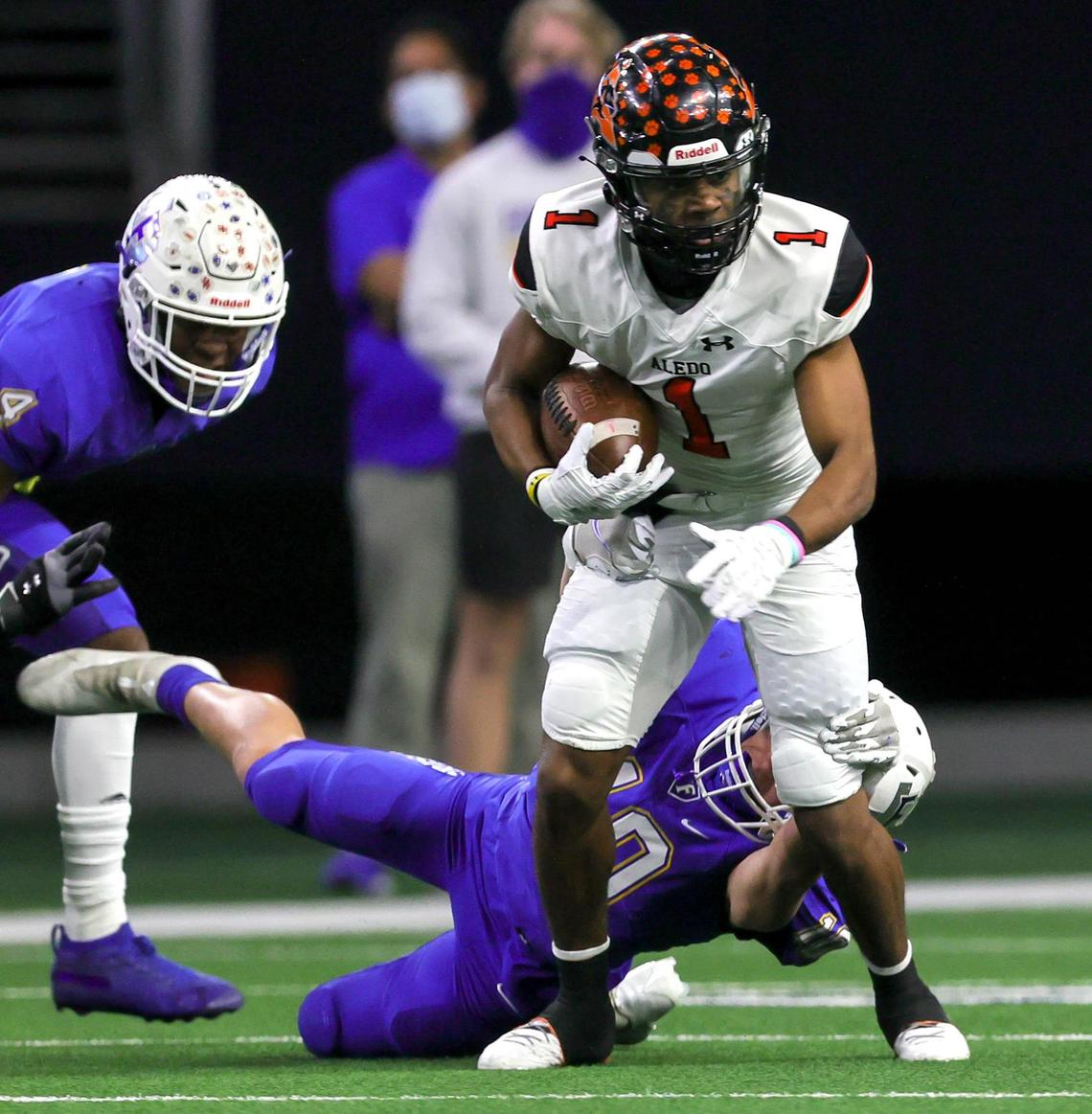 Aledo receiver Jo Jo Earle (1) looks for running room after making a reception against Frisco during the first half of the 5A Division II Regional round high school football playoffs, December 24, 2020, played at The Ford Center at the Star in Frisco, Tx. (Steve Nurenberg Special to the Star-Telegram)