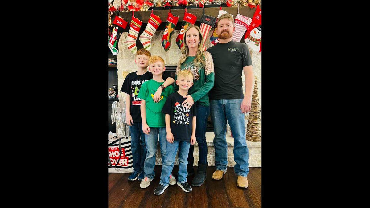 Heath Smith, 40, and his sons Wyatt, 8, and Noah, 6, are survived by his wife, Andrea (second to right), and their eldest son, 11-year-old Colin (far left). 