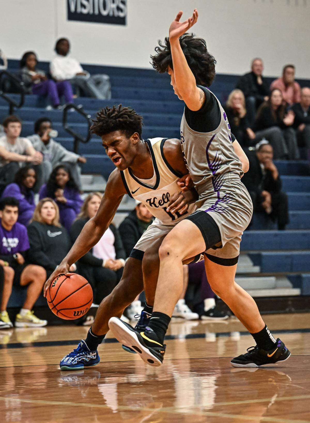 Keller’s Tyson Harris (12) looks for room to maneuver against Keller Timber Creek in a District 4-6A boys basketball game on Tuesday, January 28, 2025 at Keller High School in Keller, Texas.