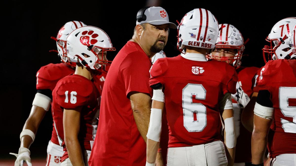 Glen Rose head coach Cliff Watkins talks to the team during a time out during a UIL football game at Tiger Stadium in Glen Rose Texas, Friday, Sept. 27, 2024.
