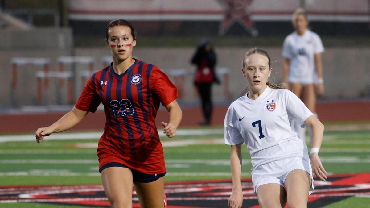 Frisco Wakeland midfielder Emma Sapp (7) takes a shot on goal in front of Grapevine defender Calleigh Cryer (23) during the Class 5A D2 UIL state semifinal girls soccer playoff game at Buddy Echols Field in Coppell, Texas, Friday, Apr. 05, 2025.